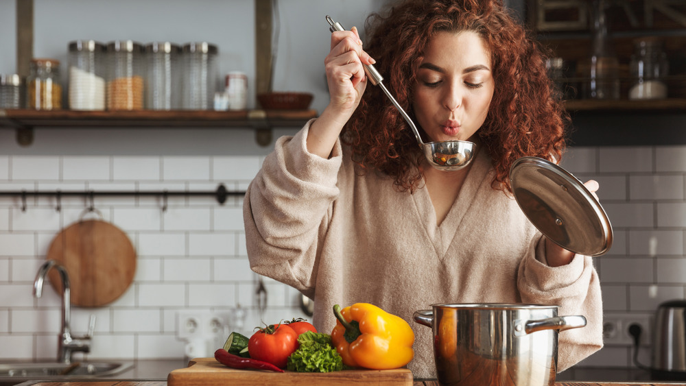 woman making soup