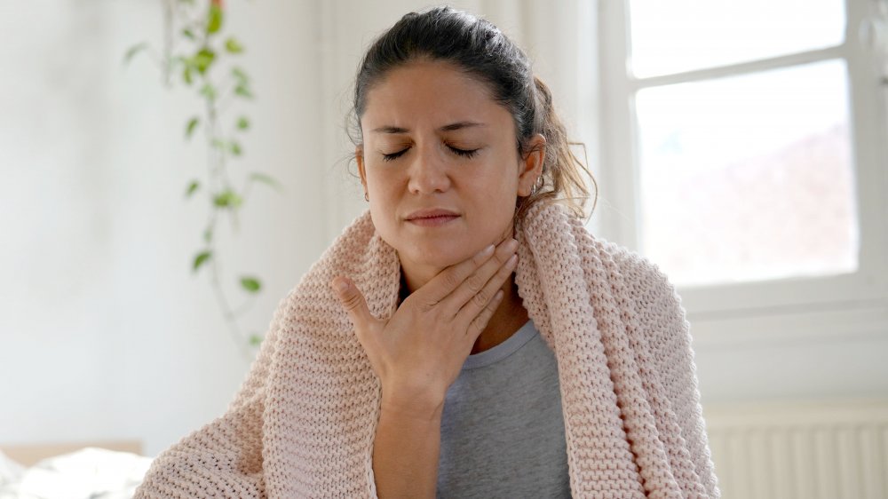 woman with sore throat